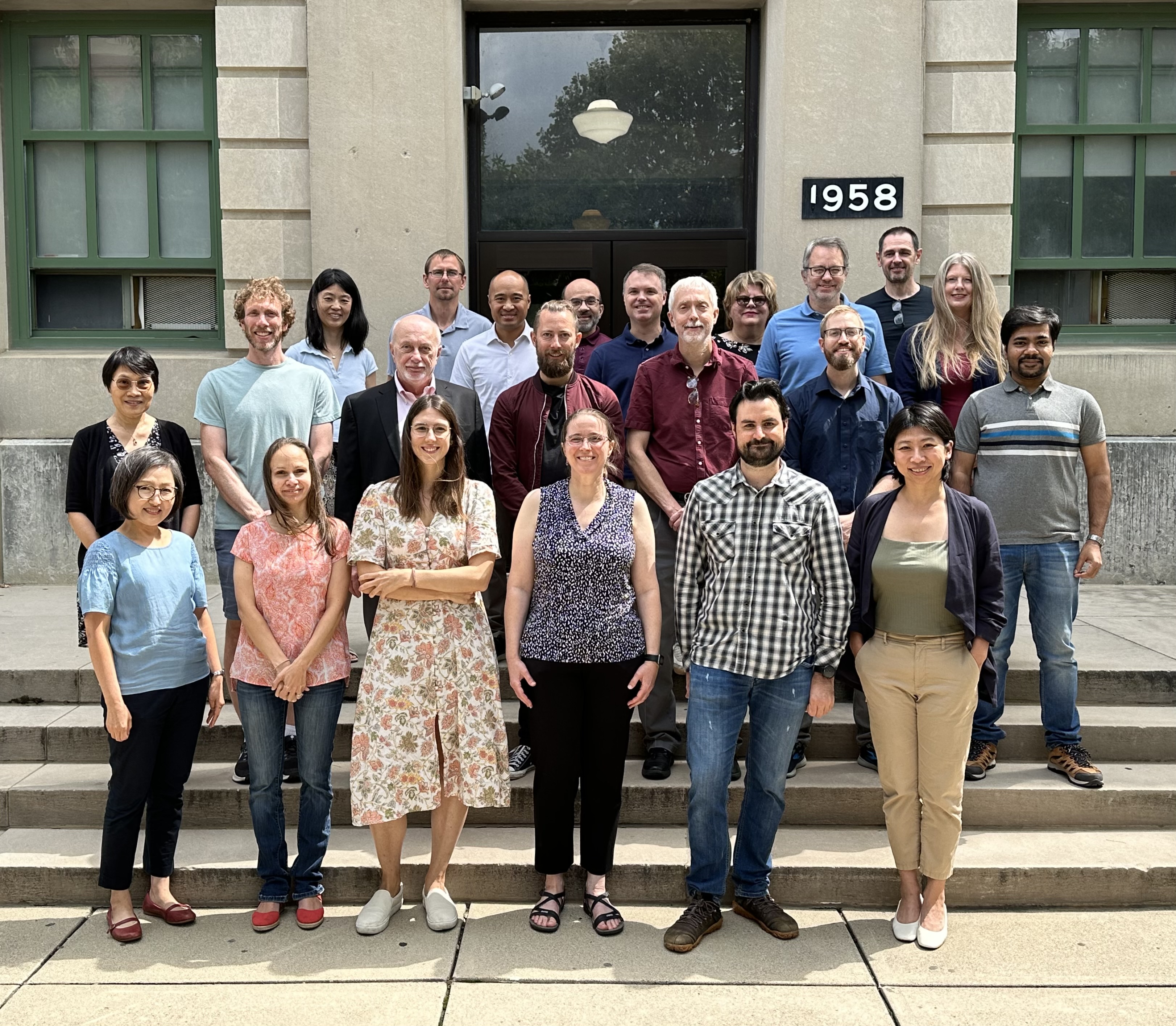 Faculty standing in front of Cockins Hall