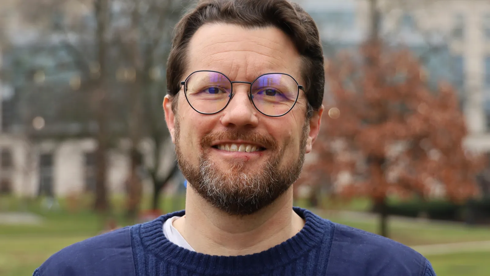 Headshot of Eben Kenah, the speaker of this event.