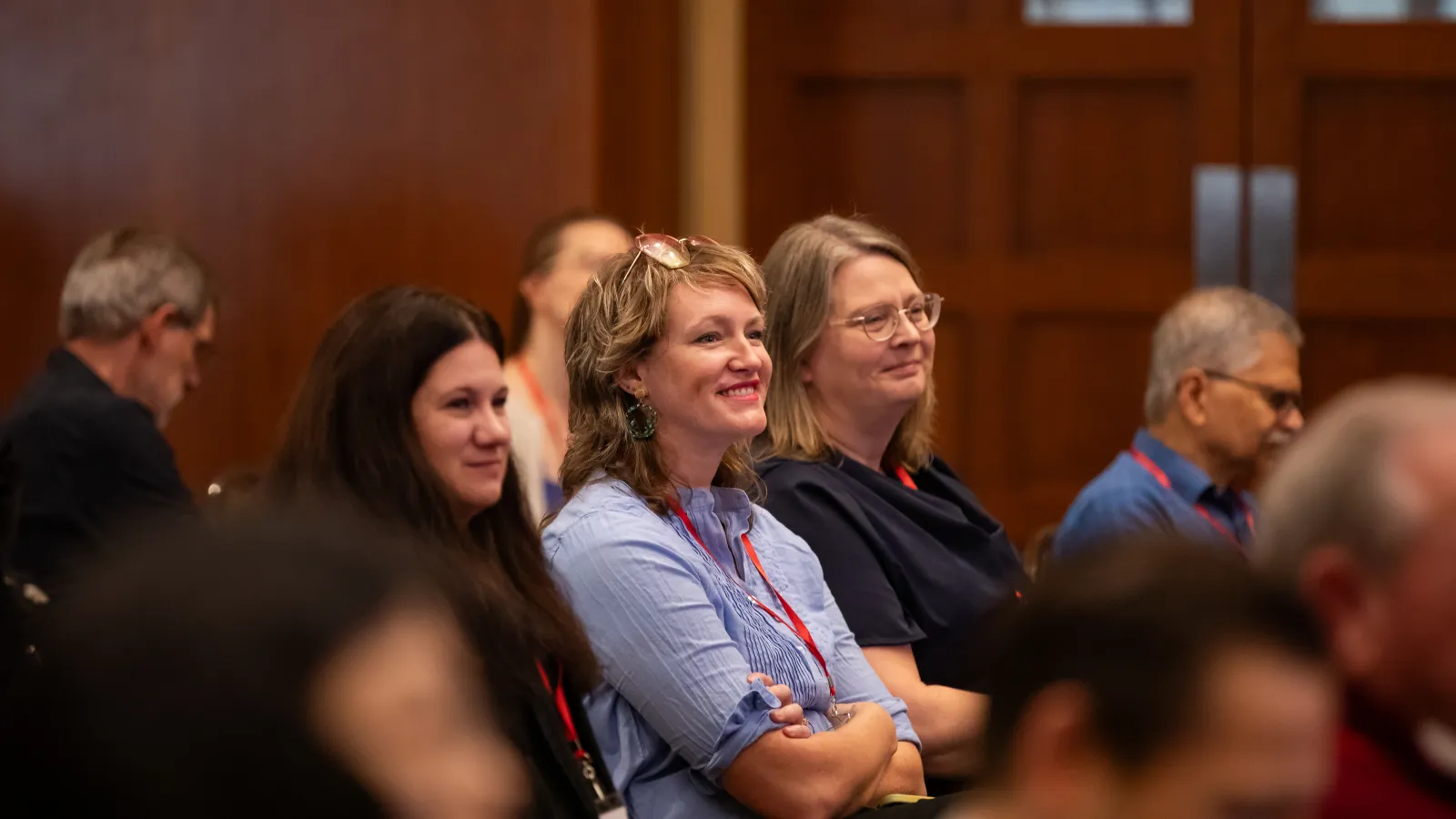 Alumni listening to a panel session