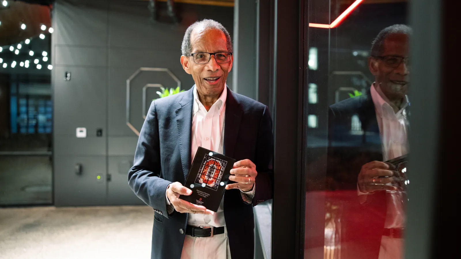 Tommy Wright holding his award