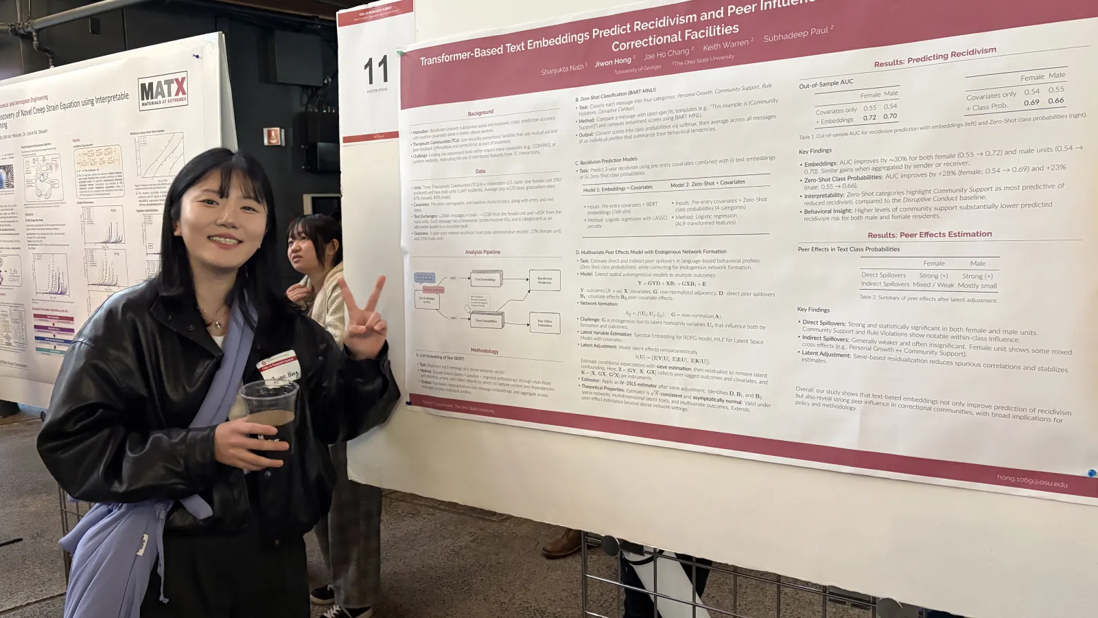 Student posing with her project board