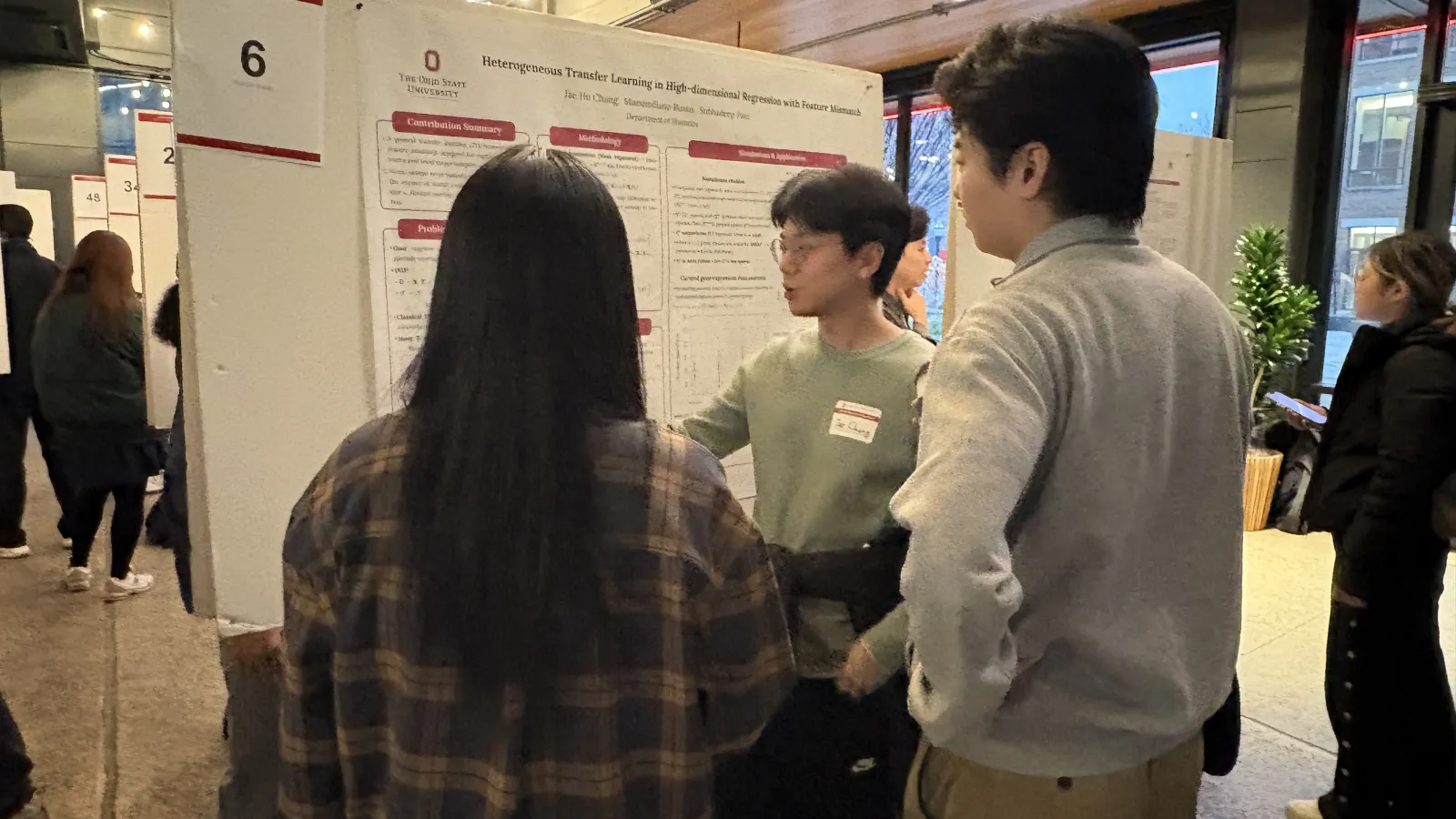 students reviewing presentation board