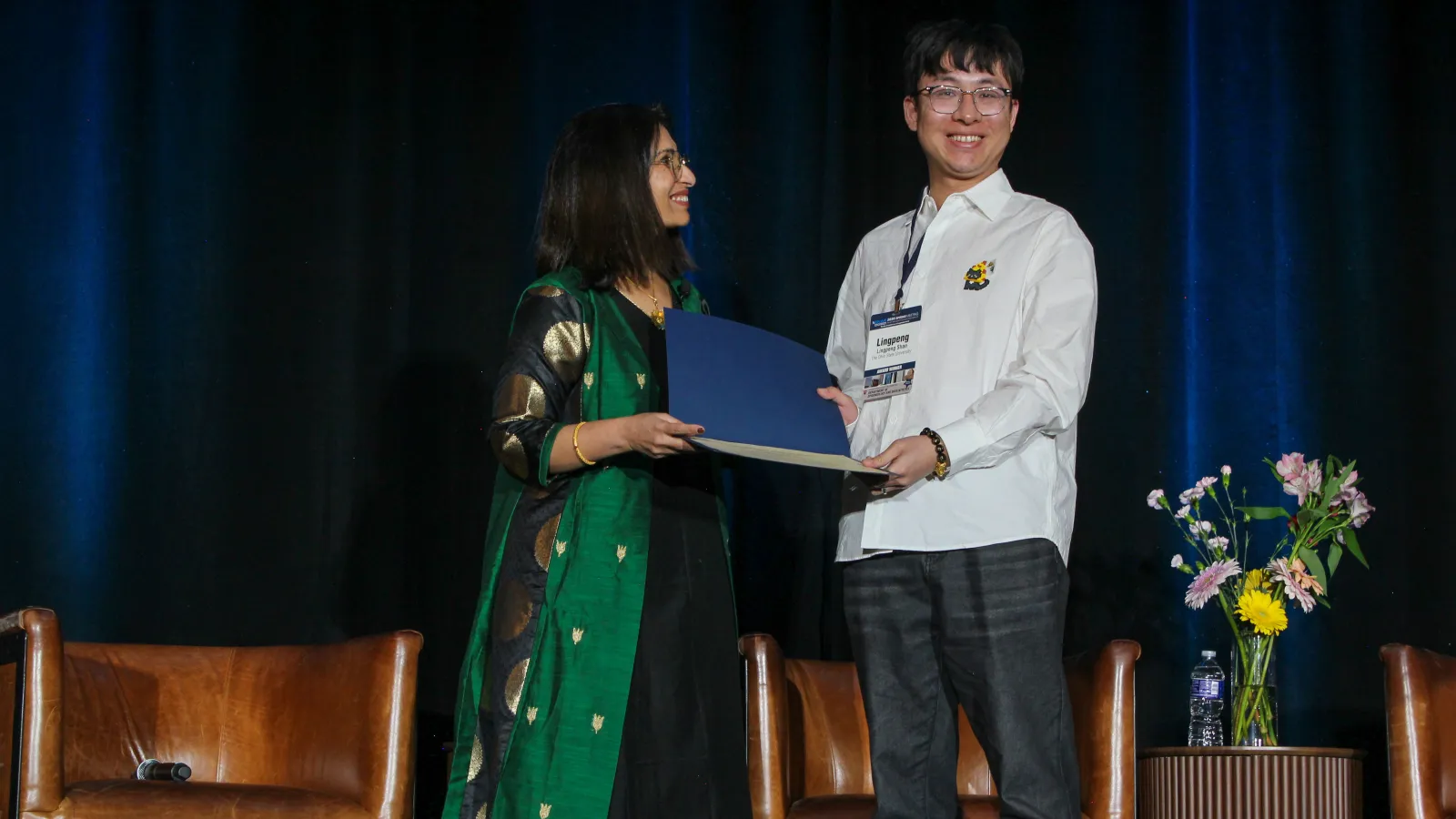 Student accepting award at event