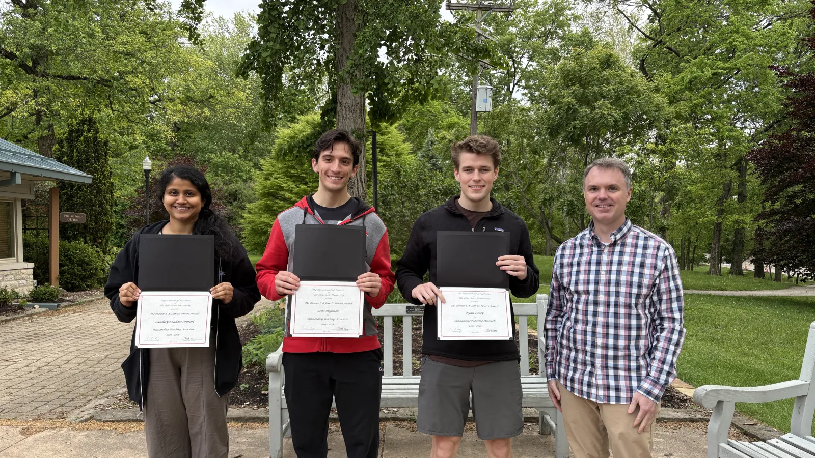 Students posing with awards