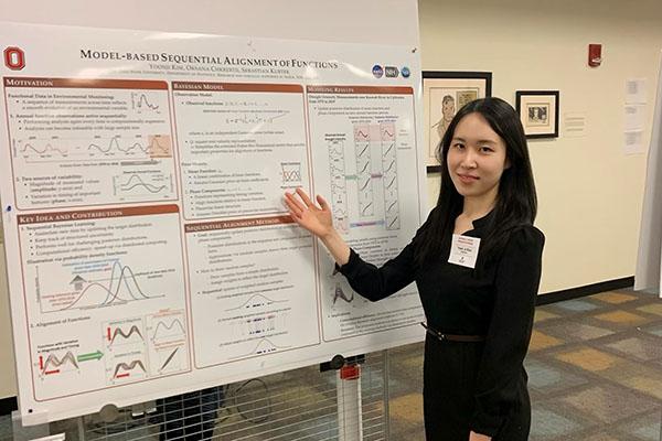 Yoonji Kim with her poster at the Hayes Graduate Research Forum
