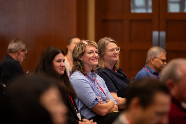 Alumni listening to a panel session