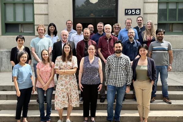 Faculty standing in front of Cockins Hall