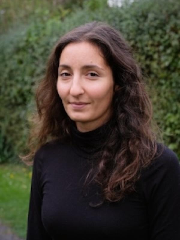 Isa Marques standing in front of trees