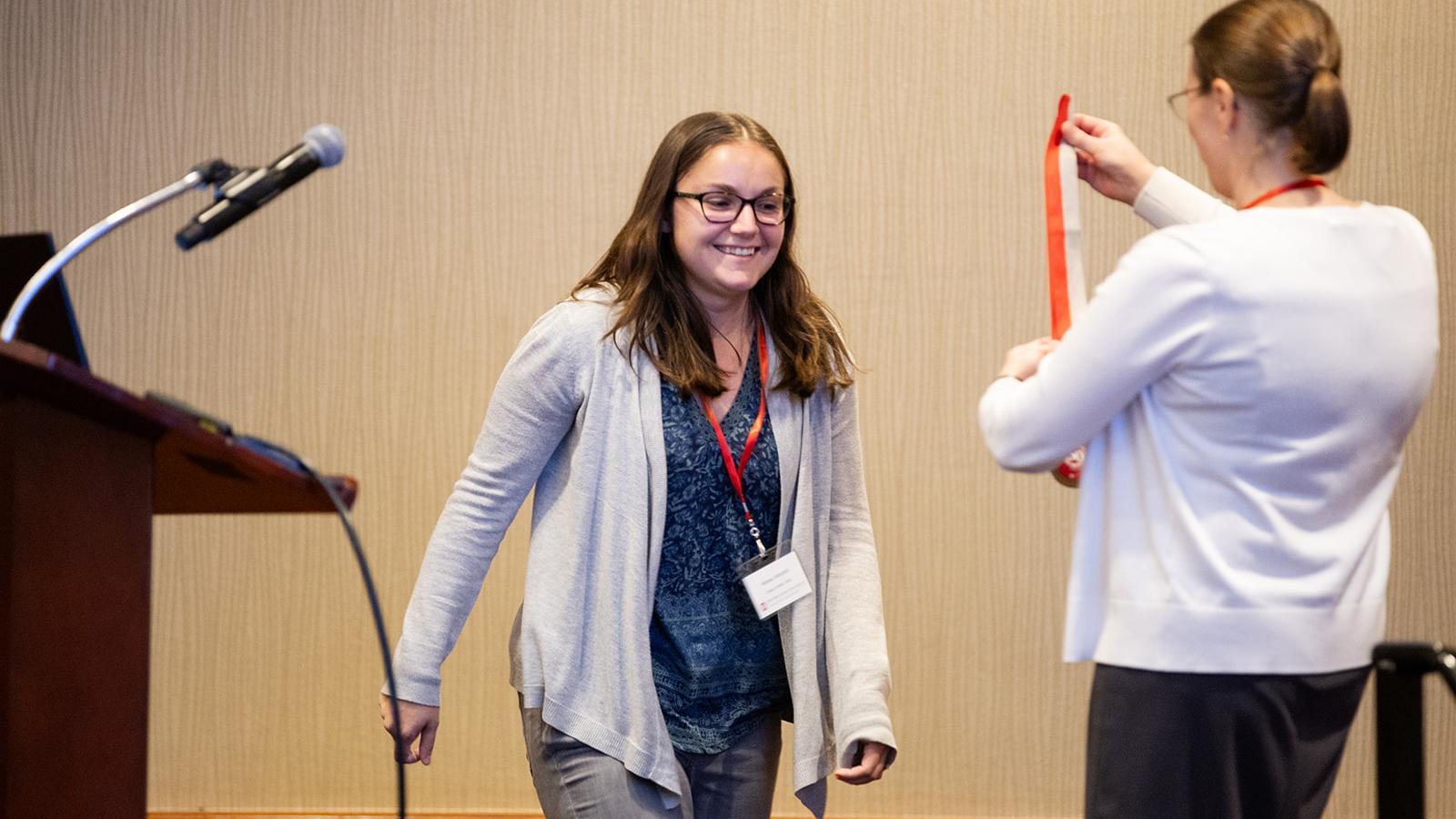 Alyssa Antonini being presented with a bronze medal