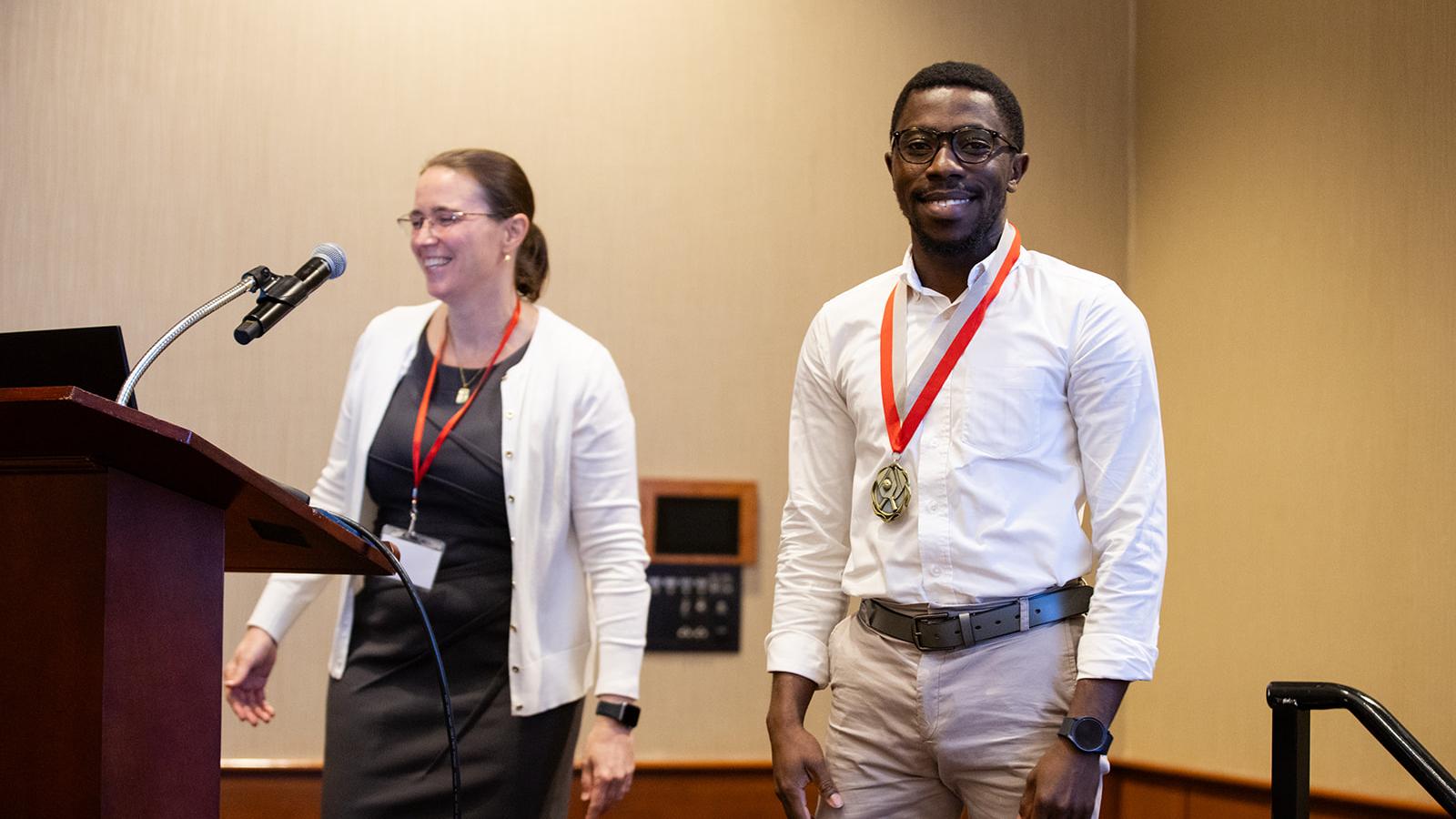Seth Adarkwah Yiadom being presented with a gold medal