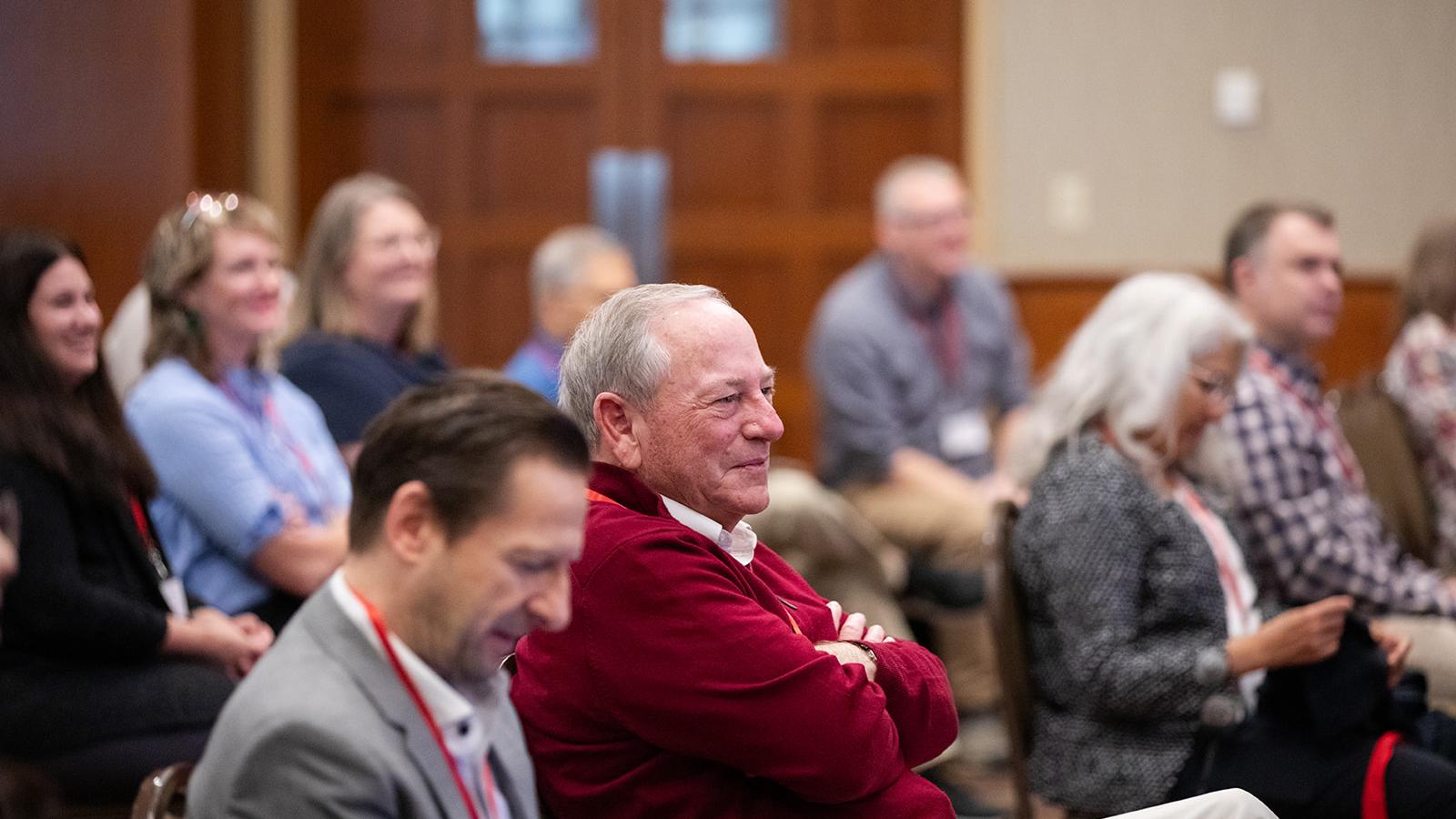 audience members listening to a panel session