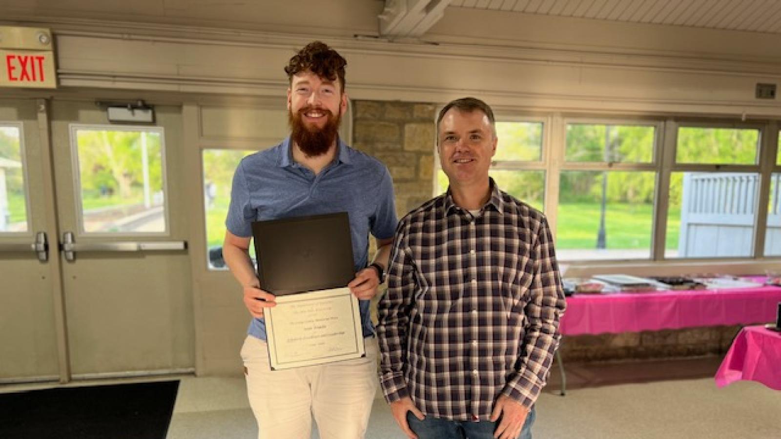 Chris Hans and Sean Tomlin, holding a certificate.