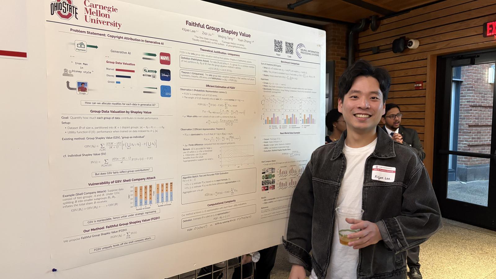 student posing with his project