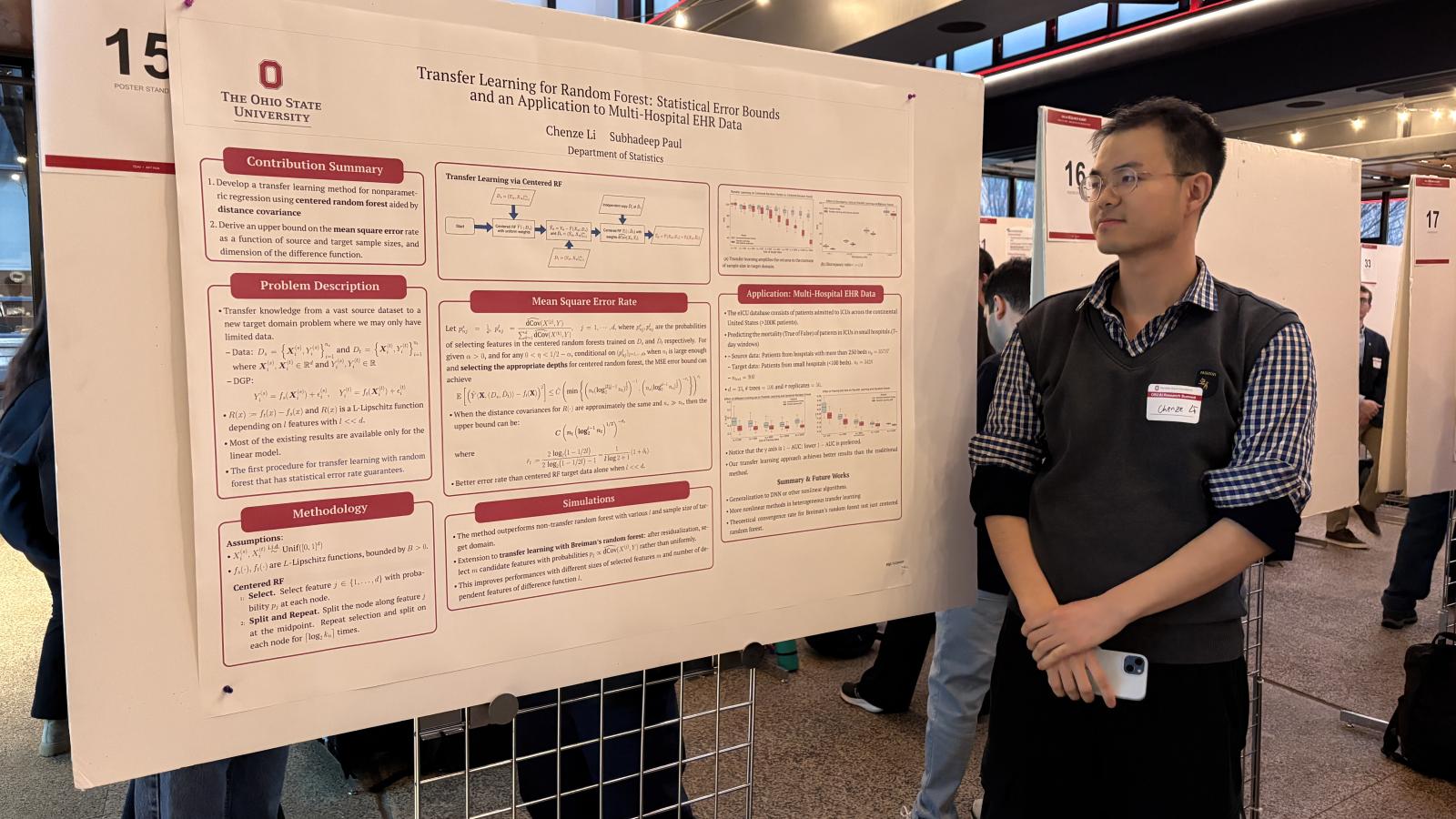 student posing with his project